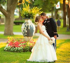 Bride and Groom in front of Landscaped garden